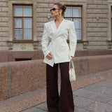 GETADME-Sexy Backless Blazers Coat Women White Lapel Hidden Buckle Long Sleeve Pocket Coats Female 2025 Summer Lady Outwear