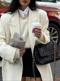 GETADME Elegant White Turn-down Collar Warm Overcoat For Women Fashion Long Sleeve Buttons Pocket Long Coats Winter New Street Outwear