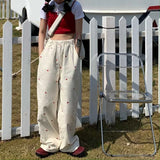GETADME Korean Women's Sports Pants Cute Wide Leg Pants Fashion Love Embroidered Joker Pants Women's Harajuku Sports Pants Beige 2025