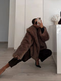GETADME Oversized Brown Fluffy Faux Fur Coats For Women Winter Autumn Loose Lapel Cardigan Jacket 2025 New High Street Warm Outwear