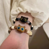 Bracelet mignon petit chat noir pour femmes et hommes, bijou tendance et amusant avec perles, fait main. Idée cadeau pour fille.