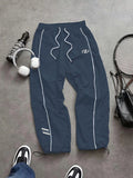 GETADME Men's Lightweight Quick-Dry Striped Logo Printed Joggers with Drawstring Streetwear Pants for Gym Daily Spring Summer