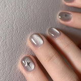 GETADME Faux ongles courts à coller, couleur nude, motif étoiles Y2K, effet œil de chat, strass, pour manucure DIY.