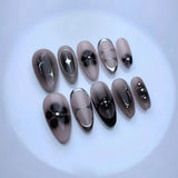 GETADME 24Pcs Black Y2k Long False Nails with Almond Head Design Cat's Eye Silver Stripe Pattern Press on Fake Nails Wearable Nail Tips