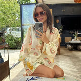 GETADME 여성 패션 신축성 허리 투피스 세트 우아한 꽃무늬 라펠 긴팔 상의 짧은 바지 정장 캐주얼 휴가 복장