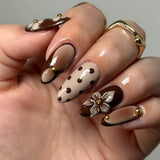 GETADME 24Pcs Black Y2k Long False Nails with Almond Head Design Cat's Eye Silver Stripe Pattern Press on Fake Nails Wearable Nail Tips