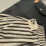 GETADME Retro Chic Solid Color Striped Skirt for Women in Summer, High Waisted and Slimming A-line Mid Length Umbrella Skirt