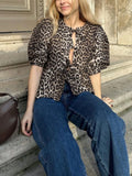 Getadme Leopard Print Shirt Women Vintage Hollow Out Lace Up Loose O-Neck Puff Sleeve Female Tops Lady Elegant High Street