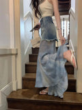 Jupe courte à volants taille haute, en patchwork de maille semi-transparente, style rétro denim été 2024, pour un effet amincissant.