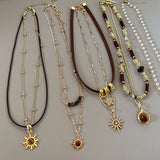 Collier GETADME Soleil Étoile Zircon pour Femme, Collier Vintage en Cuir Double Couche, Collier Ras du Cou, Bijou Tendance