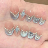 GETADME 10Pcs Cute Cat Eye Almond Fake Nail Blue Shiny with Small Rhinestone Nail Art Nude Color Short Oval Finished Artificial Manicure