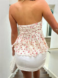 Débardeur bustier froncé à épaules dénudées et à nouer sur le devant, idéal pour les soirées d'été en club. Imprimé floral. Mini-débardeur.