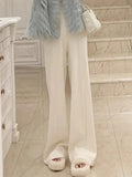 Pantalon droit en laine GETADME, taille haute, jambes larges, idéal pour l'automne et l'hiver. Coupe ample et fluide.