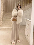 Pantalon droit en laine GETADME, taille haute, jambes larges, idéal pour l'automne et l'hiver. Coupe ample et fluide.