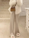 Pantalon droit en laine GETADME, taille haute, jambes larges, idéal pour l'automne et l'hiver. Coupe ample et fluide.