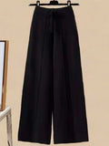 Pantalon droit en laine GETADME, taille haute, jambes larges, idéal pour l'automne et l'hiver. Coupe ample et fluide.