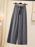 Pantalon droit en laine GETADME, taille haute, jambes larges, idéal pour l'automne et l'hiver. Coupe ample et fluide.