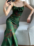 Robe longue élégante à bretelles spaghetti et imprimé floral, sans manches, moulante, style vintage, en satin, pour femme.